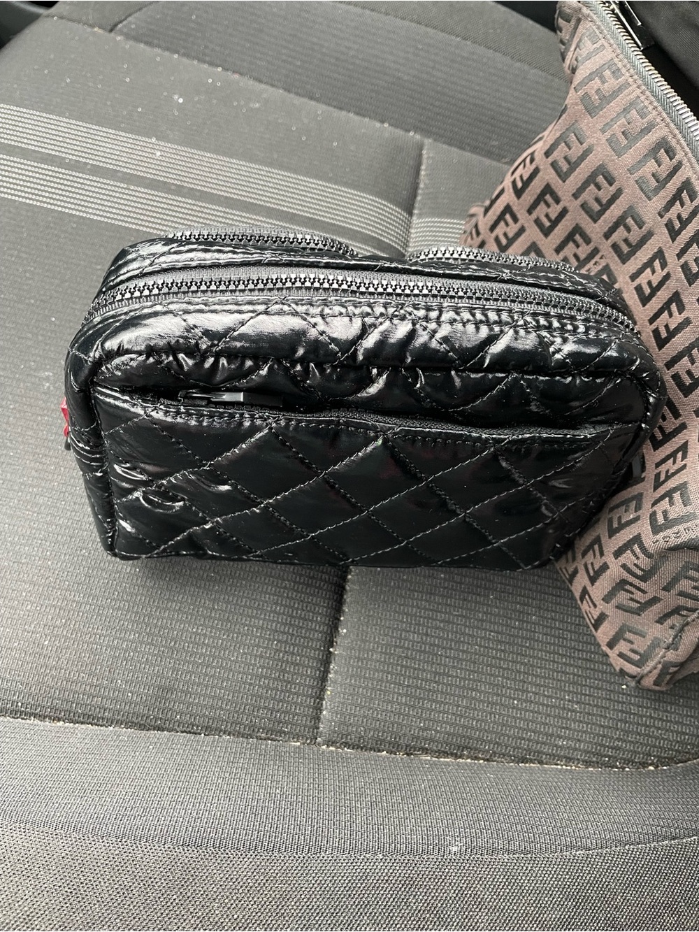MZ Wallace Black Quilted Patent Wristlet with Orange Logo Patch